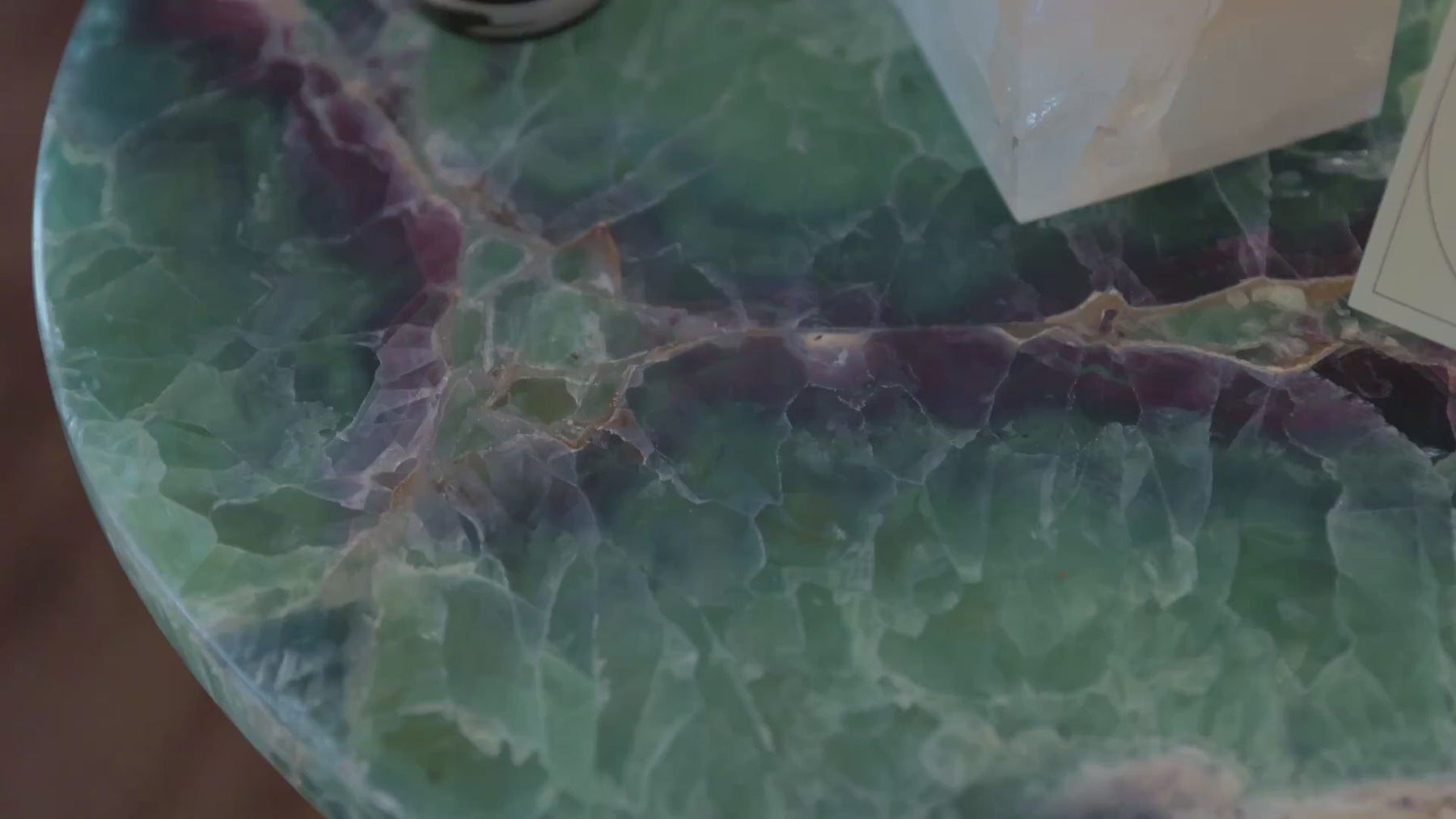 Sanamama sacred home collection featuring fluorite crystal table with candle and selenite.