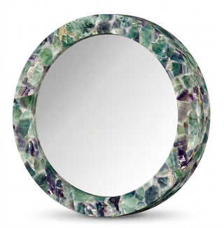 Round mirror with fluorite crystal mosaic frame in green and purple tones, product shot.