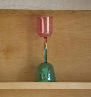 Aqua aura and pink aura gold double practitioner singing bowl displayed on wood shelf.
