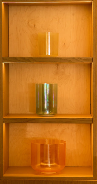 Grandmother alchemy bowl with morph and citrine bowls displayed on three-tier atelier shelving.
